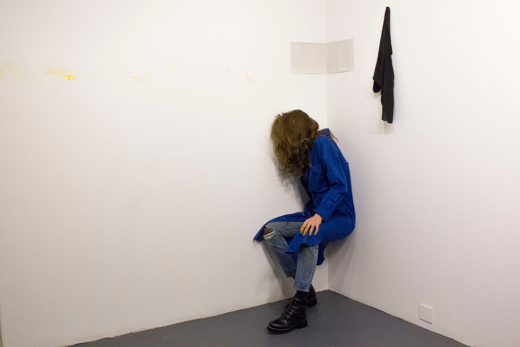 Image of Creighton Baxter in the corner of two white walls.